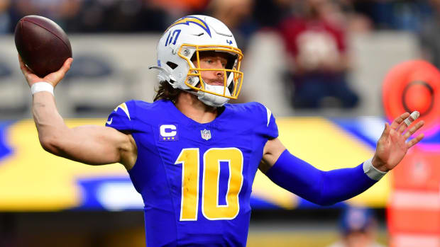 Chargers quarterback Justin Herbert throws a pass during a game.